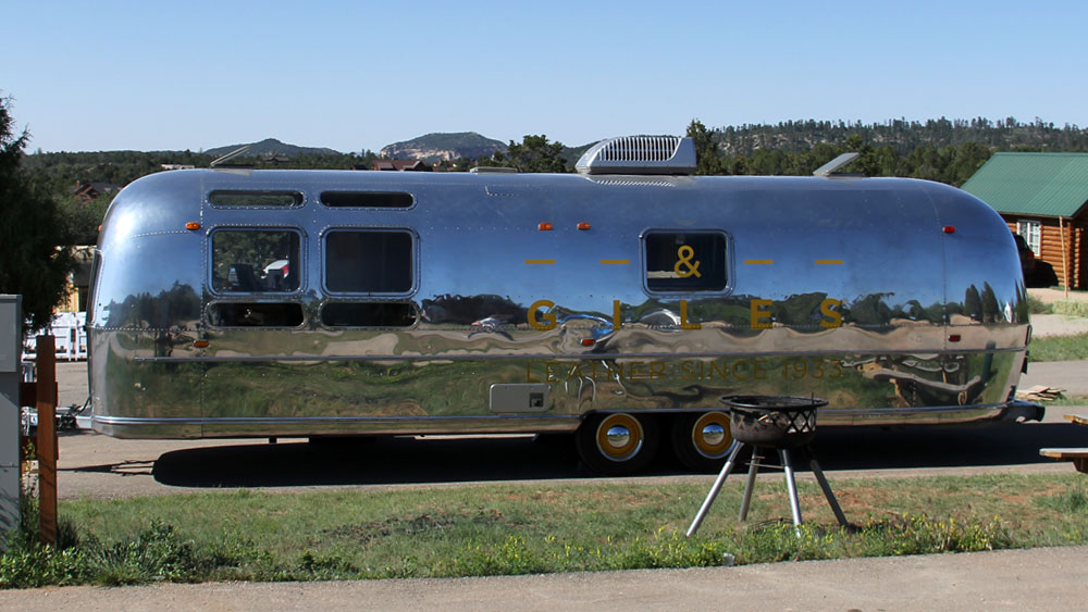 Aluminum camper trailer parked at the RV Park at Zion Ponderosa Ranch and Resort